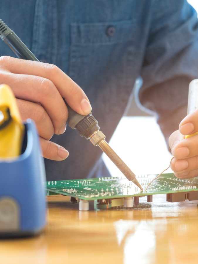 Technician repair circuit board.